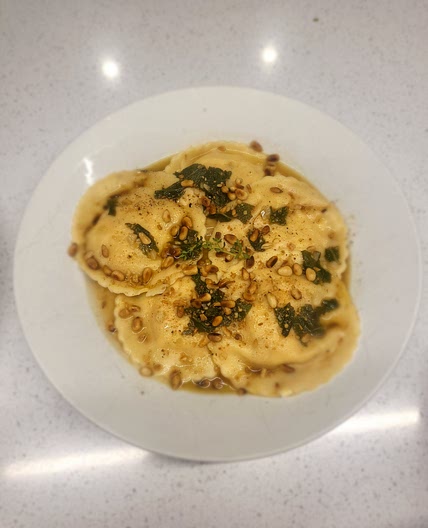 Pumpkin and feta ravioli  in butter and sage sauce