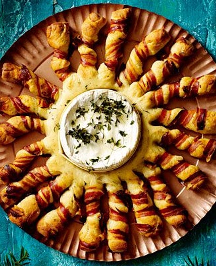 Baked camembert with bacon-wrapped breadsticks