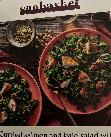 Curried salmon and kale salad with warm carrot-ginger vina 