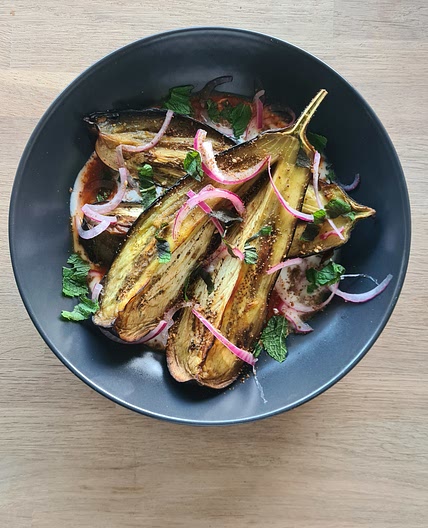Roasted aubergine with Harissa and pickled onions