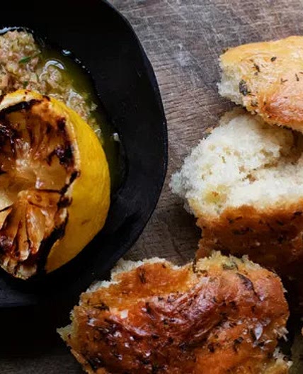 Herb focaccia with green olive, burnt lemon and thyme dip