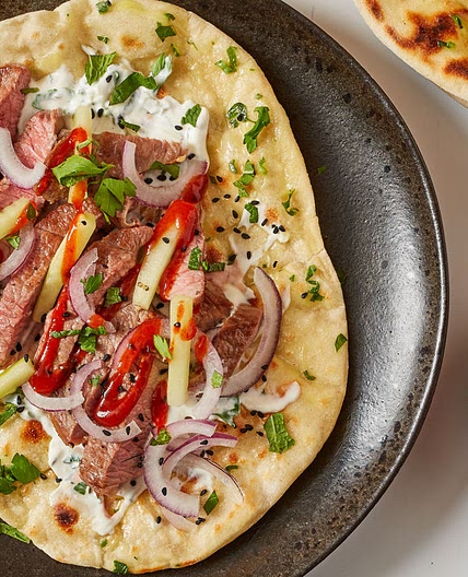 Lamb flatbreads with pickled cucumber and elderflower yoghurt