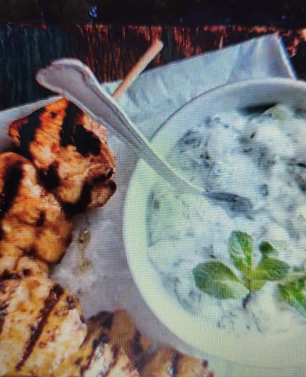 Chicken skewers with yoghurt dip and salad