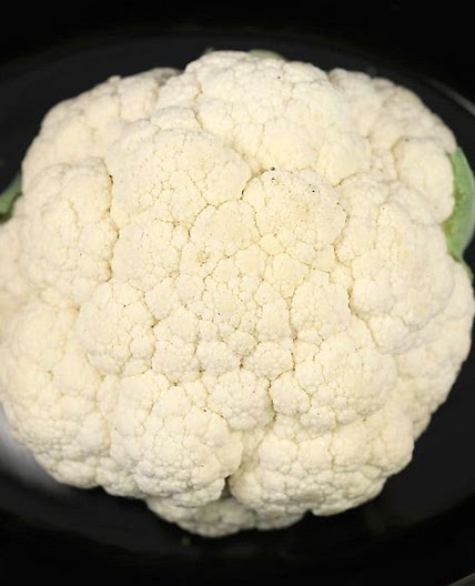 Place whole cauliflower in a slow cooker & have a tasty meal in no time