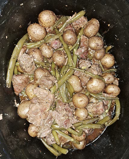 Garlic Steak Bites with Green beans and mini gold potatoes in the slow cooker.