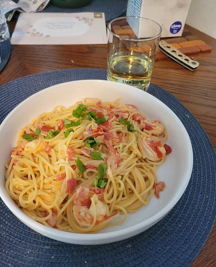 Creamy tomato shrimp spaghetti with basil