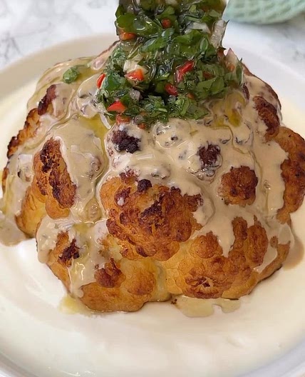 Roasted cauliflower with garlicky yoghurt, served with tahini an