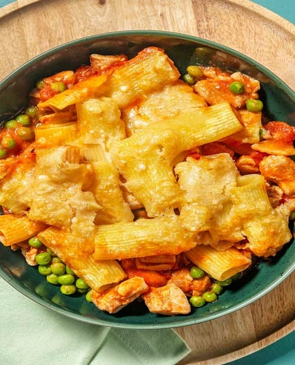 Layered Creamy Chicken Pasta Bake with Tomato Sauce, Peas and Cheese