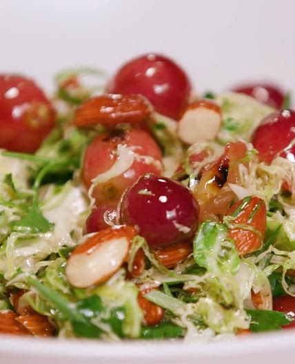 Shaved Brussels Sprouts with Charred Grapes and Toasted Almonds