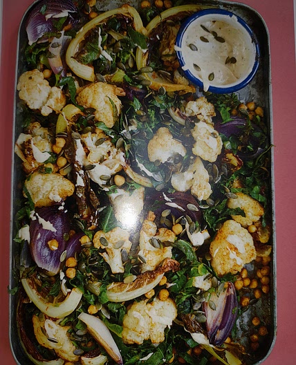 Roasted cauliflower with chickpeas, spring greens, lemon and tahini