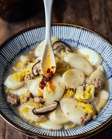 Braised Rice Cakes (Nian Gao) with Napa Cabbage, Shiitake and Po