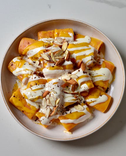 Pumpkin pasta with pecorino cheese, almonds and coffee