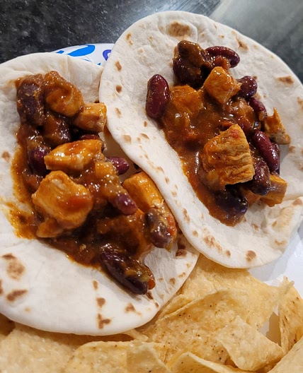 Chicken Chili Tacos with beans and sour cream