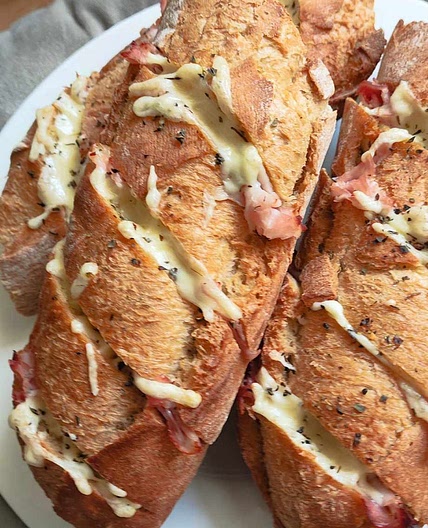 Home made garlic baguettes with prosciutto cotto and cheese