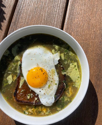 Açorda à Alentejana ( cilantro garlic broth with toast and a sunny side up egg)