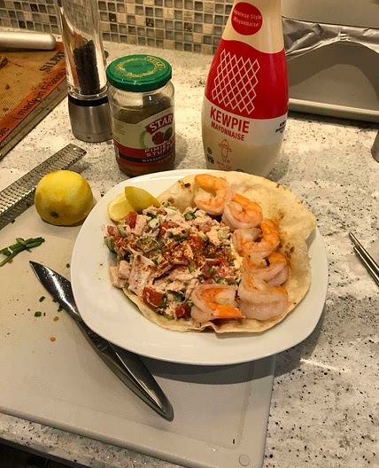 Tuna and shrimp salad with lemon zest, cucumber, and paprika