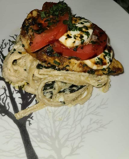 Chicken Caprese with fettuccine alfredo.