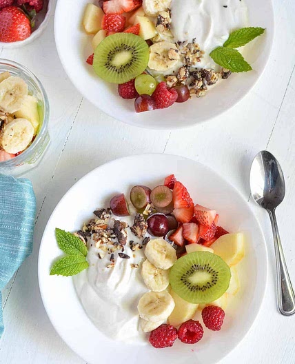 Fruit salad topped with Greek yogurt