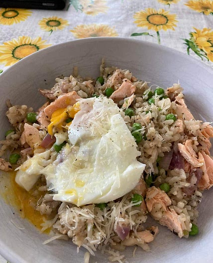 Salmon, pea and lemon Risotto topped with a poached egg