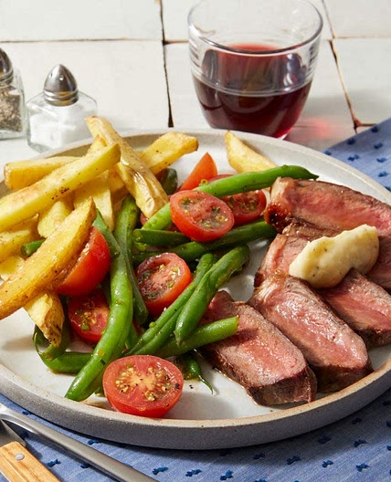 Strip Steaks & Garlic Butter with Oven Fries & Tomato-Green Bean Salad
