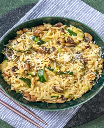Mushroom risotto with orzo, zucchini, walnuts, and pecorino