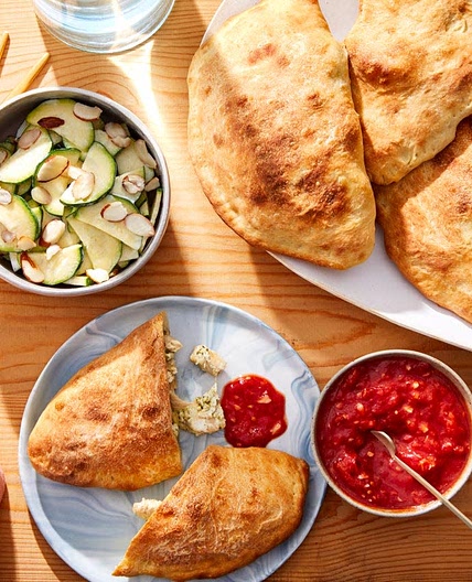 Cheesy Pesto Chicken Calzones with Tomato Sauce & Marinated Zucchini