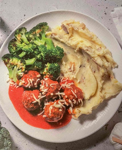 Meatballs in Cajun tomato sauce with mash