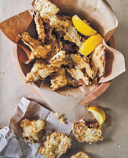 Battered and Fried Cabbage with Crispy Seeds and Lemon