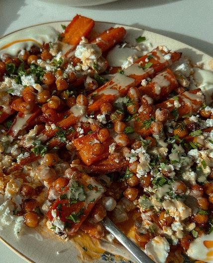 Harissa roasted carrots + chickpeas served with creamy yogurt, f