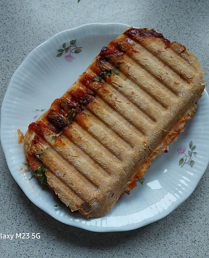 Mushroom arugula panini