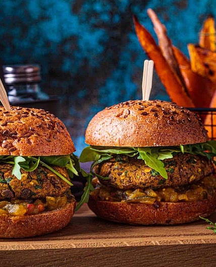 Chickpea burger, coconut onion rings, garlic and herb sauce 