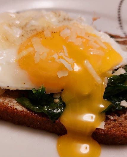 Rye bread - Fried eggs, spinach, and parmesan flakes