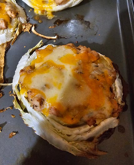 Cabbage slices covered with chicken and cheese.