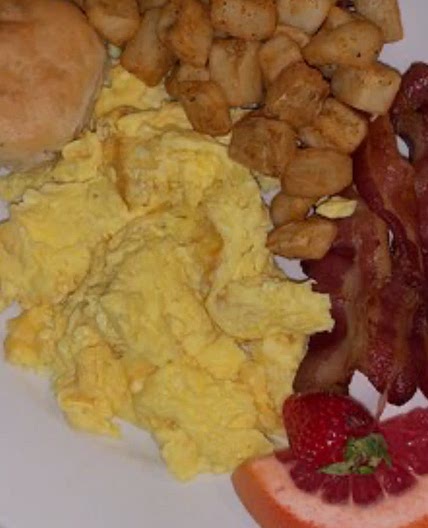 Eggs, bacon, fried potatoes, and biscuits