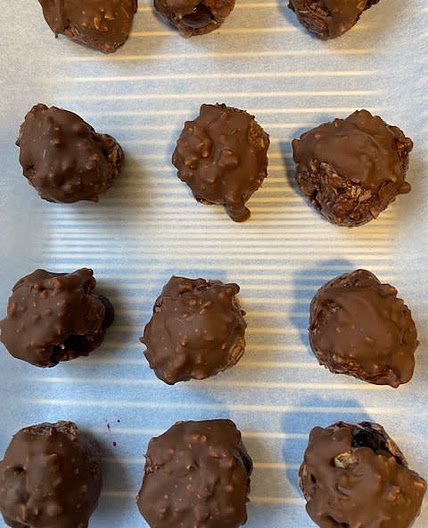 Blueberry peanut butter balls covered in Chocolate