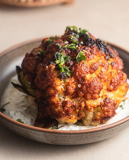 Whole-Roasted Harissa Cauliflower with Garlic Yogurt