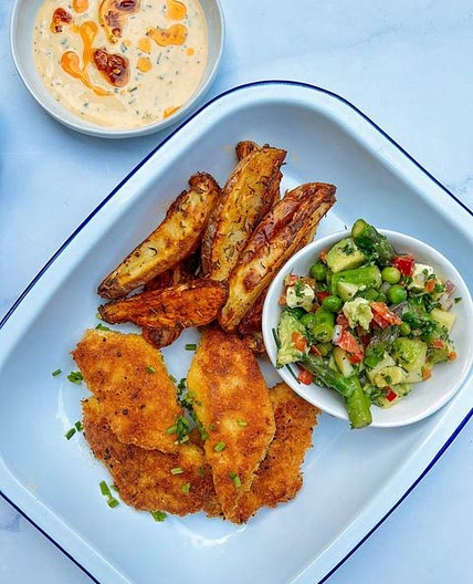 Crispy Parmesan panko fish with an asparagus pea avocado feta sa