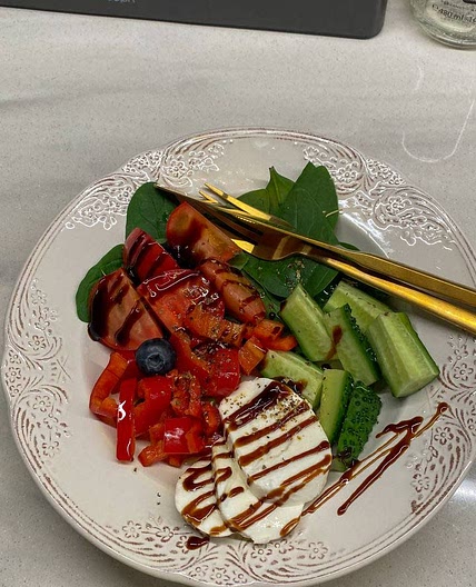 simple salad with cucumber, pepper, tomatoes and cheese