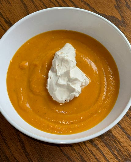 Sweet potato soup with rum cream