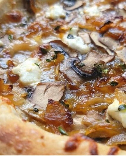 Sourdough pizza with fig jam and caramelized onions