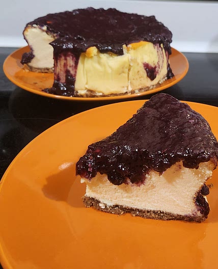 Cottage cheese Cheesecake topped with fruit preserves and nuts.