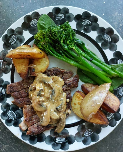 Mushroom sauce steak dinner
