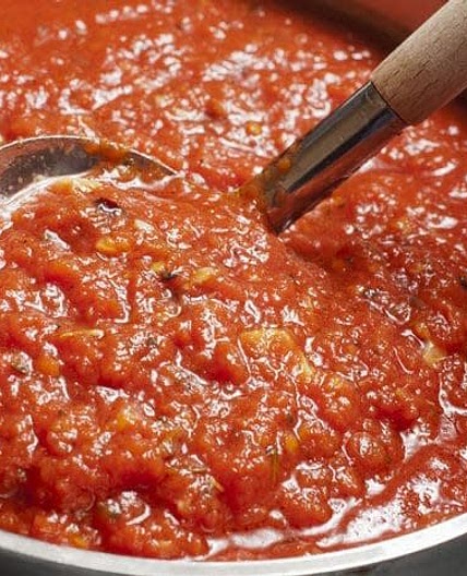 Nanny's famous authentic Italian gravy, spaghetti sausage and meatballs.