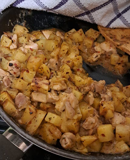 Cheasy, spicy chicken and potatoes