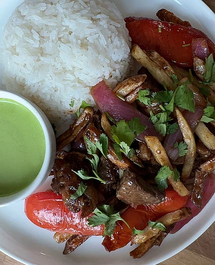 Lomo Saltado with fries 