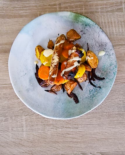 Saucisses de porc nappées d'une sauce au miel-moutarde