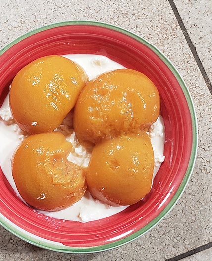 Homemade cottage cheese and peaches