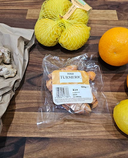 Health shot (ginger, turmeric, lemon, orange,. pepper)