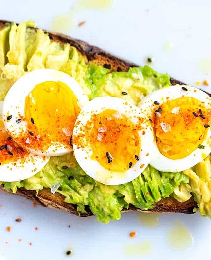 Avocado toast with hard boiled egg and red pepper flakes