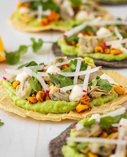 Clam and avocado tostadas